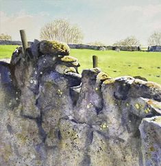 a painting of some rocks in the grass