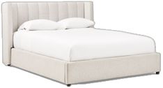 a bed with white linens and pillows on it's headboard, in front of a white background