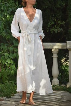 Bring the romance and chic style of Provence into your everyday with this elegant, linen dress in soft, stonewashed white. The perfect dress for any occasion, Anaïs allows you to travel effortlessly in graceful comfort and adjusts beautifully to a variety of body shapes and sizes. Sizing tip: this dress features a wide neckline and wrap style that is best suited fitted to the body. If in between sizes or if you have narrow shoulders, or smaller chest size, size down. 100% OEKO-TEX® Linen stonewa French Bleu, Sukienki Maksi, Linen Wrap Dress, White Linen Dresses, French Blue, Style Chic, Linen Dresses, Comfortable Dress, Linen Clothes