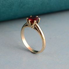 Garnet Solitaire Ring, Diamond Cut Ring, Red Garnet Handmade Ring, Minimalist Ring, Gold Filled Garnet Ring, Gift For Her, Wedding Gift Ring Welcome to My shop We provide the Excellent quality Jewelry to our Customers. Customer satisfaction is our first priority Handmade Items PRODUCT:- Ring Material:- Brass ♥ We have brass and 925 sterling silver rings in all size for both men and women. ♥ We always use precious and semi precious gemstone for making jewelry.If you have any design in your mind s Classic Red Promise Ring, Red Solitaire Ring For Promise, Red Solitaire Promise Ring, Red 14k Gold Heart Ring For Promise, Red Birthstone Promise Ring With Round Band, 14k Gold Red Heart Ring For Promise, Red 14k Gold Heart Promise Ring, Classic Red Birthstone Ring, Red Round Band Promise Jewelry