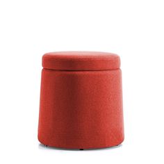 a red ottoman sitting on top of a white floor