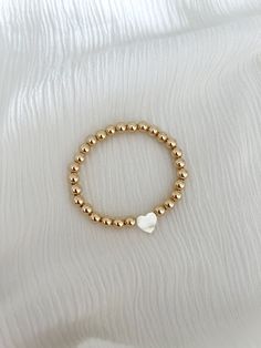 Mother of pearl heart on your choice of our 4mm or 6mm gold ball bracelet 14k gold filled Breclate Aesthetic, Lana Concert, Gold Ball Bracelet, Ball Nails, Preppy Makeup, Preppy Gifts, Preppy Jewelry, Pearl Heart, Jewelry Accessories Ideas