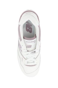 New Balance 550 smooth leather sneakers with contrasting inserts, side perforations, signature "N" inlay on the sides, "NB" logo print on the back and "550" print on the side. Padded nylon tongue with fabric logo tag, technical fabric heel tab, fabric lining with removable insole, rubber sole with side embossed logo and contrasting bottom. Composition: 100% TR, 100% leather New Balance Skate Shoes With Perforations For Sports, New Balance Sporty Skate Shoes With Perforations, Low-top Sports Sneakers With Padded Tongue, Low-top Sneakers With Padded Tongue For Sports, Classic Sneakers With Padded Tongue For Sports, Sporty High-top Lace-up Sneakers With Padded Tongue, Sporty Leather Sneakers With Padded Tongue, Sporty Lace-up High-top Sneakers With Padded Tongue, White Lace-up High-top Sneakers With Padded Tongue