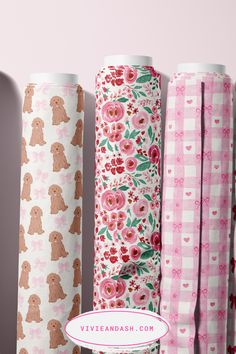 four rolls of pink and brown paper with dogs on them, all lined up in rows