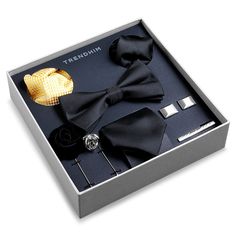 Give him the gift of style – or treat yourself to a well-coordinated formal wear look. This suit accessory gift box features a black necktie, pocket square, and pre-tied bow tie and a vibrant yellow pocket square for when you’re in the mood for some colour. The cufflinks, lapel pins, and tie clip add a sleek sliver of bling – crafted form PVD-coated brass for a finish that won’t fade or flake over time. Elegant Suit And Tie Accessories Gift Box, Elegant Suit And Tie Accessories With Gift Box, Elegant Party Ties For Father's Day, Dapper Suit And Tie Accessories For Father's Day, Elegant Bow Tie With Pocket Square As Gift, Classic Bow Tie For Suit Accessories As Gift, Elegant Bow Tie For Father's Day Party, Classic Pocket Square For Gift, Black Tie With Pocket Square For Black-tie Events