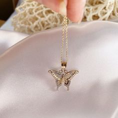 Give her the gift of wings with this beautiful butterfly necklace. DETAILS - 14k yellow gold butterfly with rhodium plating - Chain option is a 14k yellow gold cable chain - Chain style may vary slightly - Approximately 13/16 inch wide x 7/8 inch tall (including bail) VARIATIONS If you require any variation of this style (a different style chain, longer chain, etc.) feel free to message us. We will do our best to accommodate you. Additional costs may apply depending on the variation. POLICY We d Delicate Yellow Gold Butterfly Charm Necklace, Delicate Yellow Gold Butterfly Pendant Necklace, Dainty Yellow Gold Butterfly Pendant Necklace, Yellow Gold Butterfly Pendant Necklace With Delicate Chain, Yellow Gold Butterfly Charm Necklace, Yellow Gold Butterfly Pendant Necklace With Clavicle Chain, Delicate Gold Butterfly Charm Necklace, Yellow Gold Butterfly Necklace With Butterfly Clasp, Delicate Gold Necklace With Butterfly Charm