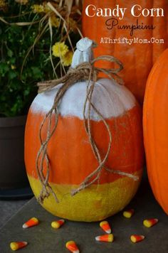 two pumpkins with candy corn on them