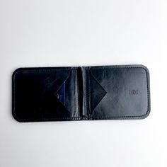 Our perfect Everyday wallet --- updated design with a few extra pockets. Carry cash + cards effortlessly with our very slim, single fold wallet. Durable Black Rectangular Wallets, Mens Money Clip Wallet, Black Textured Leather Wallet, Rectangular Travel Wallets With Silver-tone Hardware, Luxury Leather Wallet With Silver-tone Hardware, Bison Leather, Clip Wallet, Fold Wallet, Affordable Luxury