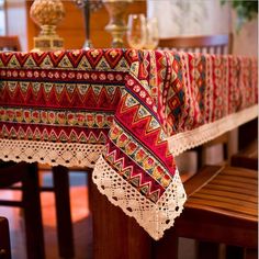 a table with a red and yellow cloth on it