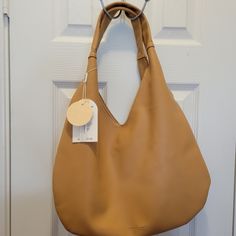 Urban Originals Vegan Leather Tan/Beige Color Bag. Brand New With Tags. Originally From Macys Trendy Beige Hobo Bag For Everyday, Trendy Everyday Beige Hobo Bag, Neutral Everyday Hobo Shoulder Bag, Neutral Hobo Shoulder Bag For Everyday, Everyday Neutral Hobo Shoulder Bag, Everyday Neutral Shoulder Hobo Bag, Neutral Hobo Bag With Adjustable Strap For Everyday Use, Everyday Neutral Leather Hobo Bag, Neutral Leather Hobo Bag For Everyday