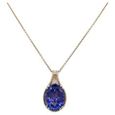 Beautiful 15.45 ct. tanzanite oval with 0.05 ct. white diamond rounds. Handmade in 14k yellow gold. Length is 18". Yellow Gold Pendants, Diamond Pendant Necklace, Gold Pendant Necklace, Tanzania, Diamond Pendant, White Diamond, Gold Pendant, Jewelry Necklace Pendant, Jewelry Necklaces