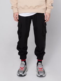 Editor's NotesPAPERBOY’s jogger pants give casual and minimal look with basic design and cargo pockets.- Adjustable drawstring in waist- Side and back pockets- Comfortable fit- Elastic band in waist and hem- Cargo pocketsMeasurements(in.)S / M / L / XL- Length: 37.8in. / 39.0in. / 39.0in. / 39.8in.- Waist: 12.2in. / 13.8in. / 14.6in. / 15.4in.- Thigh: 11.0in. / 12.2in. / 12.6in. / 13.0in.- Rise: 11.8in. / 10.6in. / 11.0in. / 11.4in.- Hem: 4.7in. / 4.7in. / 4.9in. / 5.1in.*Model Info: 5’10’’ 143. Casual Tapered Leg Cargo Pants, Streetwear Cargo Style Parachute Pants With Tapered Leg, Sporty Cargo Style Sweatpants, Elevated Casual Tapered Leg Sweatpants With Side Pockets, Relaxed Fit Joggers With Side Pockets For Elevated Casual, Casual Bottoms With Pockets And Cuffed Ankles, Athleisure Joggers With Side Pockets For Elevated Casual Wear, Techwear Cargo Pants With Tapered Leg For Streetwear, Techwear Tapered Leg Cargo Pants For Streetwear