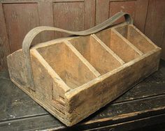 an old wooden box sitting on top of a table