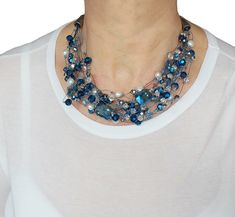 Bold statement blue necklace with various crystals and pearls. It has lovely airy feel and will be an eye-catch for a party, function or a wedding. This bridal necklace is comfortably sitting on the collar bone and the length is about 19" (adjustable). One-of-a-Kind piece. Handmade in Canada. Blue Pearl Jewelry For Party, Party Pearl Jewelry In Blue, Blue Pearl Beaded Necklace For Party, Blue Pearl Necklace For Party, Elegant Blue Pearl Beaded Necklaces, Elegant Blue Beaded Necklaces For Party, Elegant Blue Crystal Necklaces For Parties, Elegant Blue Crystal Necklace For Party, Elegant Blue Beaded Pearl Necklace