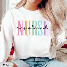 Here at Daisy May we sell the cutest Registered Nurse sweatshirts! Our Funny Nursing hoodies are made with the highest quality materials and every design is handmade to order using an eco friendly ink!  ♥How to order♥ *Please look through all product photos and double check your size with our size charts! *Choose the size, color and garment that you want!  *Add to cart! *Select your shipping option *Check out ♥Important info♥ *We do not accept returns or exchanges. If you are unsure if the garme Multicolor Hoodie Sweatshirt With Letter Print, Multicolor Letter Print Hoodie Sweatshirt, Cute Crew Neck Top With Ribbed Cuffs, Winter Multicolor Crew Neck T-shirt, Cute Crew Neck Sweatshirt With Ribbed Cuffs, White Long Sleeve Sweats With Graphic Print, White Graphic Print Long Sleeve Sweats, Multicolor Cotton Sweater With Letter Print, Pre-shrunk Relaxed Fit Hoodie