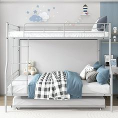 a white bunk bed sitting in a bedroom next to a desk