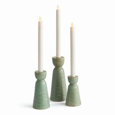 three candles are sitting next to each other