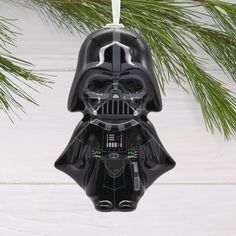 darth vader ornament hanging from a christmas tree