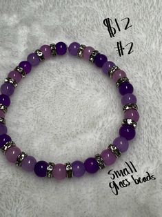 This bracelets is beautifully made with purple and lavender colored small glass beads. It is spaced with silver rhinestone accents and will look beautiful on any wrist. Adjustable Purple Beaded Bracelet With Silver Beads, Small Beads Bracelets Ideas, Adjustable Purple Jewelry With Silver Beads, Adjustable Amethyst Beads For Jewelry Making, Silver Amethyst Beaded Bracelets, Purple Faceted Round Beads, Purple Round Faceted Beads, Purple Beaded Bracelets With Silver Beads For Jewelry Making, Adjustable Purple Hand-strung Bracelets