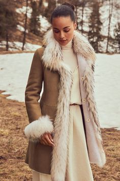 In tonal hues and with subtle sophistication, the Chantal reversible shearling coat will keep you warm while maintaining your style factor all winter long. This chic sheepskin coat is like having two distinctive looks in the same polished garment. One side displays the silky, shorn sheepskin fur, whereas the other reverses to a smooth finish that is soft to the touch. Both sides showcase distinctive fur trim around the collar, down the front, and at each cuff, making the Chantal a show-stopping Fur Cuff Coat, Tanning Hides, Alpine Chic, Coat With Fur Trim, Fashion Outerwear, Fur Trim Coat, Coat With Fur, Fur Clothing, Reversible Coat