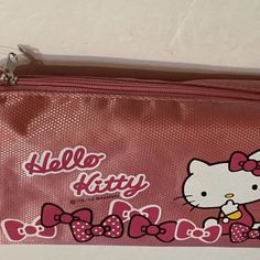 a hello kitty bag with pink bows on it