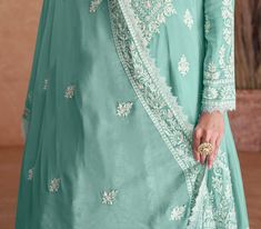 COLOR : Light Sea Green FABRIC : Top - Pure Chinon, Bottom - Pure Chinon, Inner - Santoon, Dupatta - Pure Chinon WORK : Resham Embroidery, Heavy Pearl Work, Lace Border OCCASION : Wedding, Reception, Engagement, Party Wear, Festival READY-TO-WEAR : No STITCHING : Available as semi-stitched fabric, can be stitched using standard size option (+$20). Note: There might be a slight color variation due to lighting and flash used during photoshoot. The bright shade seen is the best closer view of fabri Light Sea Green, Resham Embroidery, Pearl Work, Sharara Suit, Anarkali Gown, Green Suit, Lace Border, Sea Green, Green Fabric