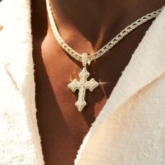 Introducing the Iced Gothic Cross in Yellow Gold - a bold addition to your pendant collection. Crafted with a durable 18k Gold and hand-set stones, this cross is guaranteed to make a statement. Pair this piece with our 5mm Tennis Chain in Yellow Gold for a complete, elevated look. This product is guaranteed for life - GLD will repair the item should you experience any defects in craftsmanship or breakage. Specifications - 35mm x 42mm (Width x Height) - Weight: (Weight can vary +/- 1 gram) - Gold Tarnish Resistant Spiritual Cross Jewelry, White Gold Necklace With Large Cross Pendant, Elegant Iced Out Cross Pendant Jewelry, Gold Cross Pendant Necklace With Bling, White Gold Large Cross Pendant Jewelry, Gold Bling Cross Pendant Necklace, Iced Out White Gold Cross Pendant Jewelry, Luxury Tarnish Resistant Cross Pendant Jewelry, Iced Out Diamond Cross Pendant Jewelry