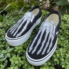 These custom Vans stackform Platform Slip On Shoes Shoes have been customized with skeleton bones of your feet. . These Vans shoes have canvas uppers.  Vulcanized waffle rubber outsoles. For Women and Men.  Are you looking for the regular Skeleton feet Vans slip on shoes? You can shop for those here: https://etsy.me/47r0lBZ We buy each pair of shoes BRAND NEW from the Vans retail store. Each pair is made to order, please make sure you put in the correct shoe size before you check out. The ink is permanent and will never come off. Made in the USA. This price includes everything: shoes, artwork, and shipping. Thanks for stopping by our Etsy shop! Please message us with any questions! Sizes listed are in US sizing scale. Note: Blvd Custom is in no way affiliated with any of the shoe brands or Custom Vans Slip On, Shoes Artwork, Custom Vans Shoes, Vans Slip On Shoes, Platform Vans, Halloween Shoes, Nike Converse, Skeleton Bones, Men's Vans