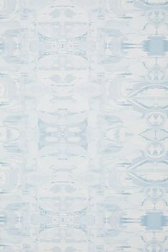 a blue and white wallpaper with an abstract design