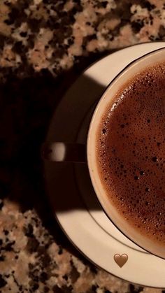 a cup of hot chocolate on a saucer