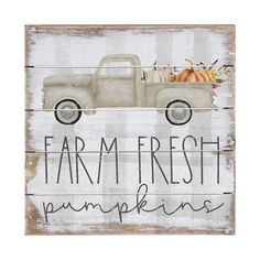 a sign that says farm fresh pumpkins and an old truck with fall leaves on it