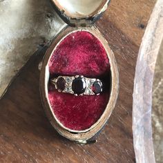 "Offered here a vintage 9ct yellow gold, red garnet and cz ring. Hallmarked 9ct, Birmingham, 1972. Maker's mark KR. Size Q 1/2. Vintage condition with signs of wear.  Weighs 3.6g (0.13oz) All items are sent well packaged, tracked and insured.  Shipping is via Royal Mail, UPS or DPD. We will combine purchases for shipping where possible. If you have any questions please don't hesitate to ask, and thank you for visiting \"Interesting, Old and Unusual\"." Cz Ring, Maker's Mark, Red Garnet, Druzy Ring, Makers Mark, Rings Statement, Red Gold, Birmingham, Royal Mail