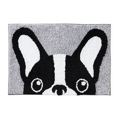 a black and white rug with a dog's face drawn on the front of it