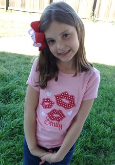 This cute tee is just your little one needs for Valentines Day! The tee is a pink or white short or long sleeve tee with fun smooches in red and white polka dots and name to personalize as shown if you would like.  Please indicate your name in comments when checking out.  Please feel free to contact me with any questionsor custom orders. Playful Short Sleeve Top For Valentine's Day, Fun Short Sleeve T-shirt For Valentine's Day, Fun Valentine's Day T-shirt With Short Sleeves, Playful Pink T-shirt For Valentine's Day, Playful Valentine's Day Crew Neck T-shirt, Playful Crew Neck T-shirt For Valentine's Day, Playful Crew Neck Top For Valentine's Day, Valentine's Day Fun Short Sleeve T-shirt, Cute Short Sleeve T-shirt For Valentine's Day