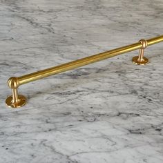 an image of a gold handle on a marble counter