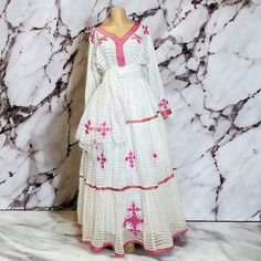 Beautiful Ethiopian and Eritrean Habeshan Dress. Stylish Menen, 100% Cotton We recommend hand washing and air drying to make it last longer. A low heating iron will also keep design and look. Cotton, it doesn't have a pocket. White Bollywood Dresses With Traditional Patterns, White Dress With Traditional Patterns For Eid, White Gown With Traditional Patterns For Eid, Eid Maxi Dress With Traditional Patterns, Traditional White Dress With Dabka Embroidery, Traditional White Dabka Dress, White Cutdana Dress For Traditional Ceremonies, Bohemian Dress For Diwali Traditional Ceremonies, White Maxi Dress For Navratri Traditional Ceremonies