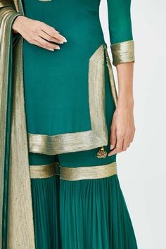 Emerald green straight short kurta with placement gold-tone sequin work. Comes with embroidered sharara pants and dupatta.
Component: 3
Embroidered
Neckine: Mandarin Collar
Sleeve Length: Three Quarter
Fabric: Chiffon
Color: Green
Side slits
Keyhole neck - Aza Fashions Unstitched Gold Embroidery Sharara For Festive Occasions, Unstitched Festive Sharara With Gold Embroidery, Festive Sharara With Gold Embroidery In Chinon, Festive Chinon Sharara With Gold Embroidery, Unstitched Sharara With Gold Embroidery For Festive Occasions, Georgette Saree Set With Gold Embroidery, Semi-stitched Sharara With Gold Embroidery In Chinon, Festive Georgette Lehenga With Gold Embroidery, Festive Semi-stitched Sharara With Gold Embroidery