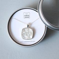 This sea glass mosaic necklace is made with genuine sea glass and sterling silver. The all white glass pendant can be worn casually or for a special occasion. The bezel setting is silver plated and beautifully crafted. The sea glass is expertly set into the bezel, each piece carefully chosen based on one color, shape and size. The pendant is strung on an 18" sterling silver chain. Chain length can be adjusted, please specify what you would like in the "notes to seller" at checkout. The necklace White Recycled Glass Jewelry Gift, Handmade White Sea Glass Jewelry, Minimalist Recycled Glass Jewelry For Gifts, Nickel-free White Glass Jewelry, White Minimalist Glass Jewelry, White Sea Glass Necklace As A Gift, White Sea Glass Jewelry Gift, White Sea Glass Necklace For Gift, Clear Sea Glass Jewelry For Gifts