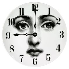 a clock with an image of a woman's face and numbers on the face