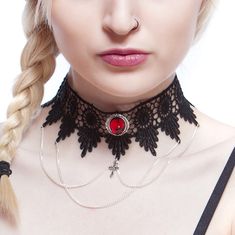 This choker combines the elegance of black venise lace with a beautifully ornate Ruby red pendant (26 x 22 mm), draped chains and a small central cross (20 x 10 mm).  The lace is finished off securely with an extender chain which allows the necklace/choker to be worn at any size from 13 to 15.5 inches. With the addition of an extender chain you can be sure of getting the fit you want and can choose between wearing the choker higher or lower on the neck.  This item can be made larger or smaller if required at no extra cost.  The Lucretia venise lace choker is available in Black Onyx, Sapphire blue, Emerald green, Deep purple and Ruby red.  There are three photos of the Emerald green Lucretia being worn. Gift wrapping All jewellery is beautifully presented and ready for gift giving, sprinkle Valentine's Day Party Choker Necklace, Elegant Clavicle Chain Choker For Valentine's Day, Gothic Clavicle Chain Jewelry For Halloween, Gothic Chain Jewelry As A Gift, Gothic Clavicle Chain Necklace For Halloween, Valentine's Day Punk Party Jewelry, Gothic Halloween Clavicle Chain Necklace, Vampire Style Choker Necklace For Halloween, Vampire Style Halloween Choker Necklace