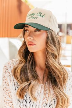 Calling all cowgirls! Elevate your style with our Country Club Cowboy Trucker Hat. Featuring an embroidered western graphic, this trendy hat is the perfect accessory to complete any casual outfit. Perfect for spring and summer, wear it to concerts and festivals for a chic and fashionable look. Available in 2 colors! Twill cap Made in USA Embroidery at front and side panel Adjustable back strap Brim measures approx 3" in lengthOS measures approx 23.55" in circumference Western Flat Brim Baseball Cap For Rodeo, Western Style Baseball Cap With Curved Brim For Rodeo, Western Style Curved Brim Baseball Cap For Rodeo, Country Style Flat Brim Baseball Cap For Rodeo, Trendy Baseball Cap For Country Events, Casual Curved Brim Snapback Hat For Country Events, Casual Snapback Hat With Flat Brim For Rodeo, Casual Flat Brim Baseball Cap For Rodeo, Spring Rodeo Flat Brim Trucker Hat