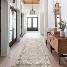 the hallway is clean and ready for us to use as an entrance way in this home