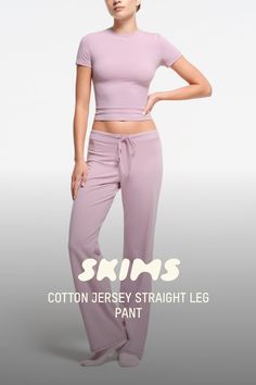 The comfiest lounge staple, designed with your favorite ultra-soft Cotton Jersey fabric. This straight-leg pant style features a ribbed waistband with an exterior drawcord at the waist. Make it a set with the Cotton Jersey T-Shirt. Fits true to size. | SKIMS Straight Leg Pant | Pink | XS | Cotton Jersey Fitted Cotton Sweatpants For Lounging, Fitted Wide Leg Loungewear Activewear, Elastane Sweatpants With Elastic Waistband For Loungewear, Fitted Wide Leg Activewear For Loungewear, Relaxed Fit Full Length Activewear For Loungewear, Spring Loungewear Activewear, Stretch Straight Leg Loungewear, Elastane Bottoms With Elastic Waistband For Loungewear, Fitted Lounge Bottoms With Elastic Waistband