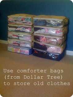 a stack of clothes sitting on top of a wooden floor next to a wall with the words, use comforter bags from dollar tree to store old clothes