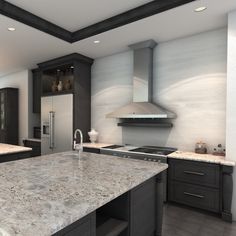 a large kitchen with marble counter tops and black cabinets, along with stainless steel appliances