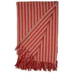 a red and white striped towel with fringes