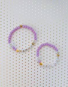 "This dainty MOMMY & DAUGHTER matching bracelet set is the cutest accessory ever! It is the best way to show off the ❤️love between you and your little girl! Each bracelet comes with a 24K heart bead and 24k gold beads AND a happy 😄 face bead to tell everyone how lucky you are to be a mom! Of course, you can have any names/words on the bracelets! 💝Add an extra charm or 2 for a low price of $1 each - https://etsy.me/36LE9om 💗We offer gift wrapping option with a nice jewelry box and make th Cute Adjustable Name Bracelet For Everyday, Customizable Cute Friendship Bracelets For Mother's Day, Cute Personalized Friendship Bracelets For Mother's Day, Cute Bracelets For Mother's Day, Cute Customizable Friendship Bracelets For Mother's Day, Cute Personalized Bracelets For Valentine's Day, Cute Mother's Day Jewelry With Letter Beads, Cute Personalized Bracelets, Cute Personalized Everyday Bracelets