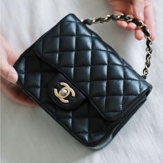 2019 Chanel Mini Square Classic Flap - Black Lambskin The Modernized Chanel Mini Square Classic Flap Bag Has Become One Of The Most Coveted And Sought After Chanel Styles. This Particular Bag Is Only 3 Years Old Is In Great Condition. Details: Width: 6.5 In Depth: 2.5 In Height: 5.5 In Chain Strap Drop: 20 In. Condition: Great Condition. Rubbing And Signs Of Wear On Corner Edges. Some Scuffs In Interior Flap. Gold Hardware Is Showing Signs Of Tarnishing. Accessories: Comes With Chanel Dust Bag. Chanel Mini Square, Chanel Classic Flap Bag, Mini Classic, Classic Flap Bag, Chanel Mini, Chanel Fashion, Chanel Bags, Classic Flap, Flap Bag