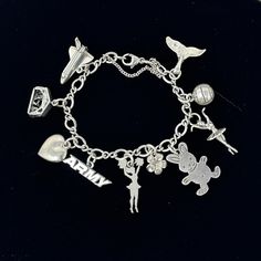 "🌼 James Avery 925 sterling silver charm bracelet with 10 charms, 4 are marked Avery charms, the other 6 are sterling silver charms and the chain bracelet with safety chain is marked Avery.  Charms are 925 whale tail Avery volleyball  925 ballerina  925 rabbit  flower Avery cheerleader Avery Army 925 puffy heart 925 nativity Avery space shuttle. 🌼 Measures: 6\".  My wrist is 6\" and it just fits. 🌼 Condition: overall very good, the top wing on the space shuttle is slightly bent. Please see al Silver Sterling Silver Charms With Removable Feature, Sterling Silver Charms With Removable Feature, Hypoallergenic Dangle Charm Bracelet In Sterling Silver, Sterling Silver Charm Bracelet With Removable Dangle Charms, Sterling Silver Charm Bracelet With Removable Charms, Sterling Silver Dangle Charm Bracelet With Removable Charms, Silver Sterling Charm Bracelet With Dangling Charms, James Avery Bracelet, Rabbit Flower