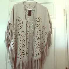 **** Never Worn*****Beautiful Embroidered, Beige Soft Suede Poncho With Flowing Fringes One Size Spring Cape Outerwear, Spring Fringe Shawl Outerwear, Spring Festival Shawl Outerwear, Spring Cream Cape, Cream Poncho One Size For Spring, Cream One Size Summer Outerwear, Casual Beige Spring Poncho, Beige Long Sleeve Bohemian Cape, Spring Cream Outerwear With Fringe